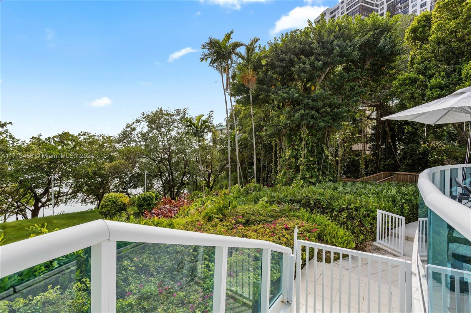 2127 Brickell Avenue, Unit 2804 Miami, FL 33129 - Photo 50 of 72 a view of a wooden fence and trees
