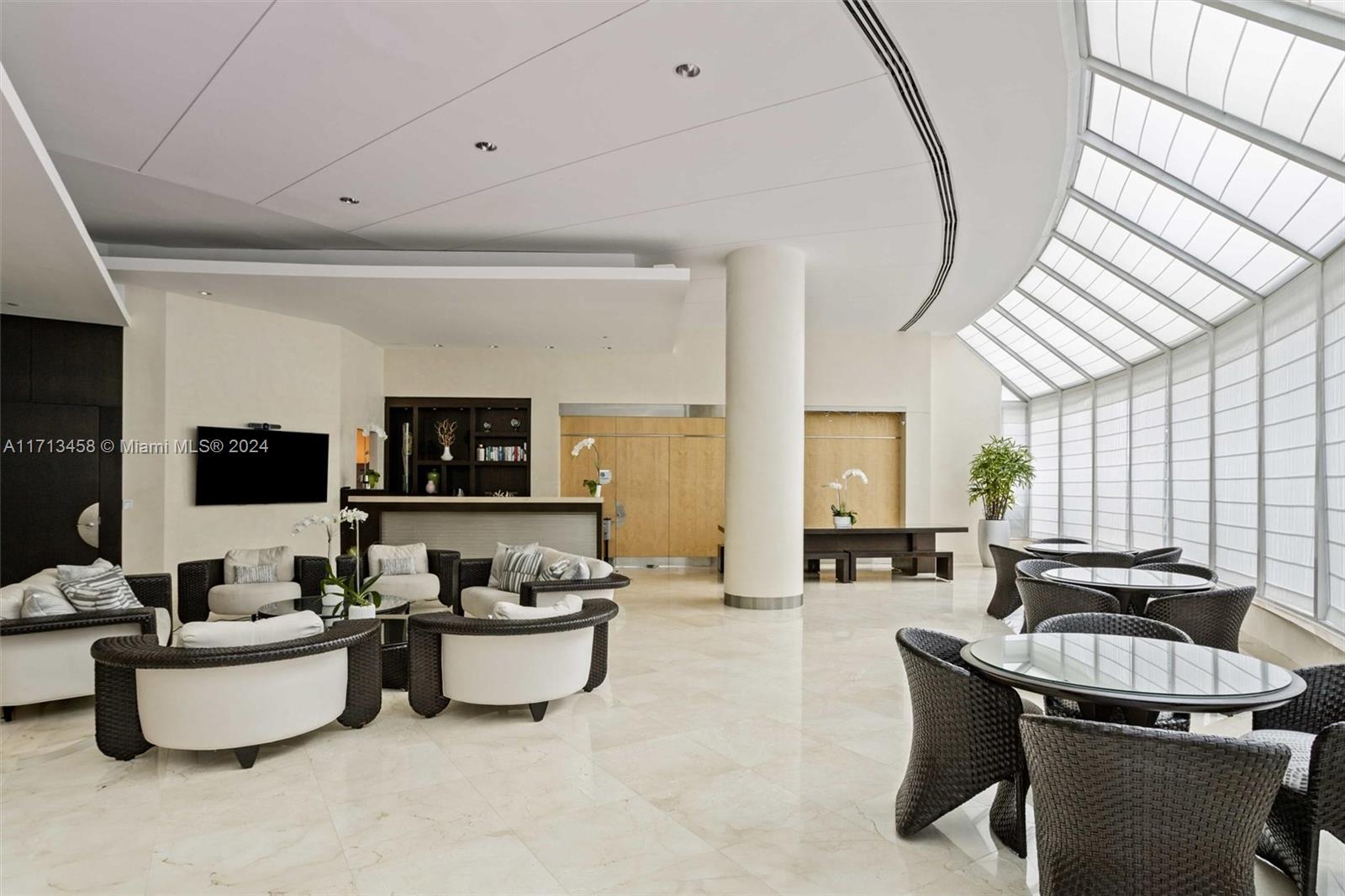 2127 Brickell Avenue, Unit 2804 Miami, FL 33129 - Photo 56 of 72 a living room with furniture and a large window