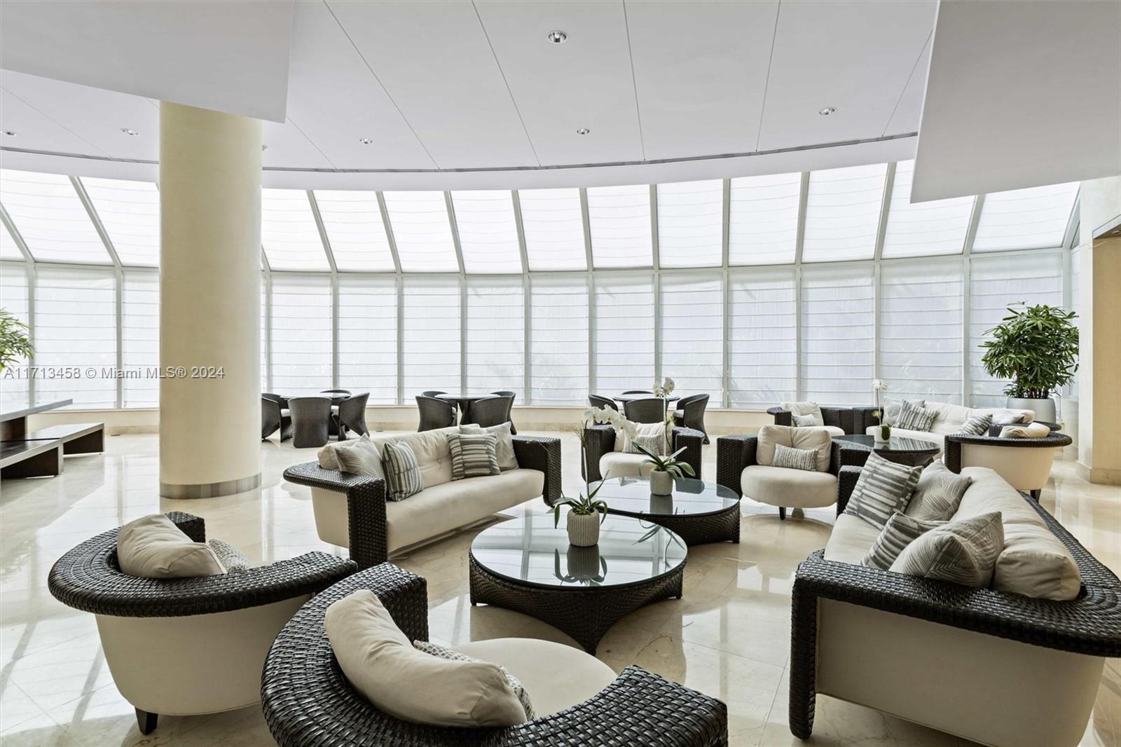 2127 Brickell Avenue, Unit 2804 Miami, FL 33129 - Photo 57 of 72 a living room with furniture and a large window