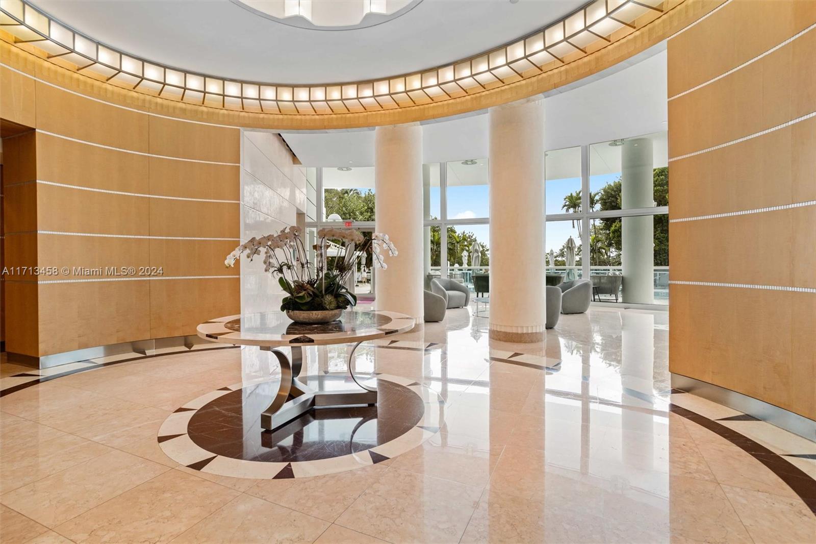 2127 Brickell Avenue, Unit 2804 Miami, FL 33129 - Photo 58 of 72 a view of a lobby with furniture and a potted plant