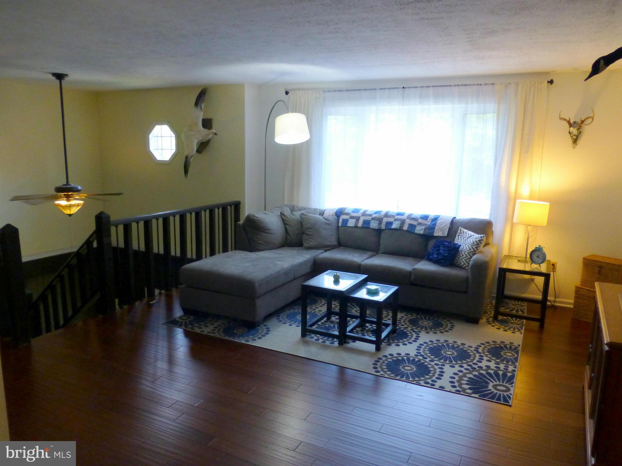 1816 Potomac Road Edgewater, MD 21037 - Photo 5 of 30 a living room with furniture and wooden floor