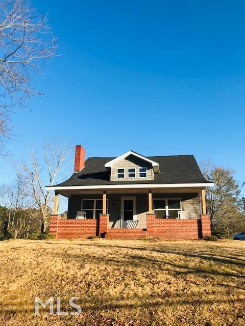 2210 Calhoun Road Northeast Rome, GA 30161 - Photo 1 of 1 a front view of a house with a garden