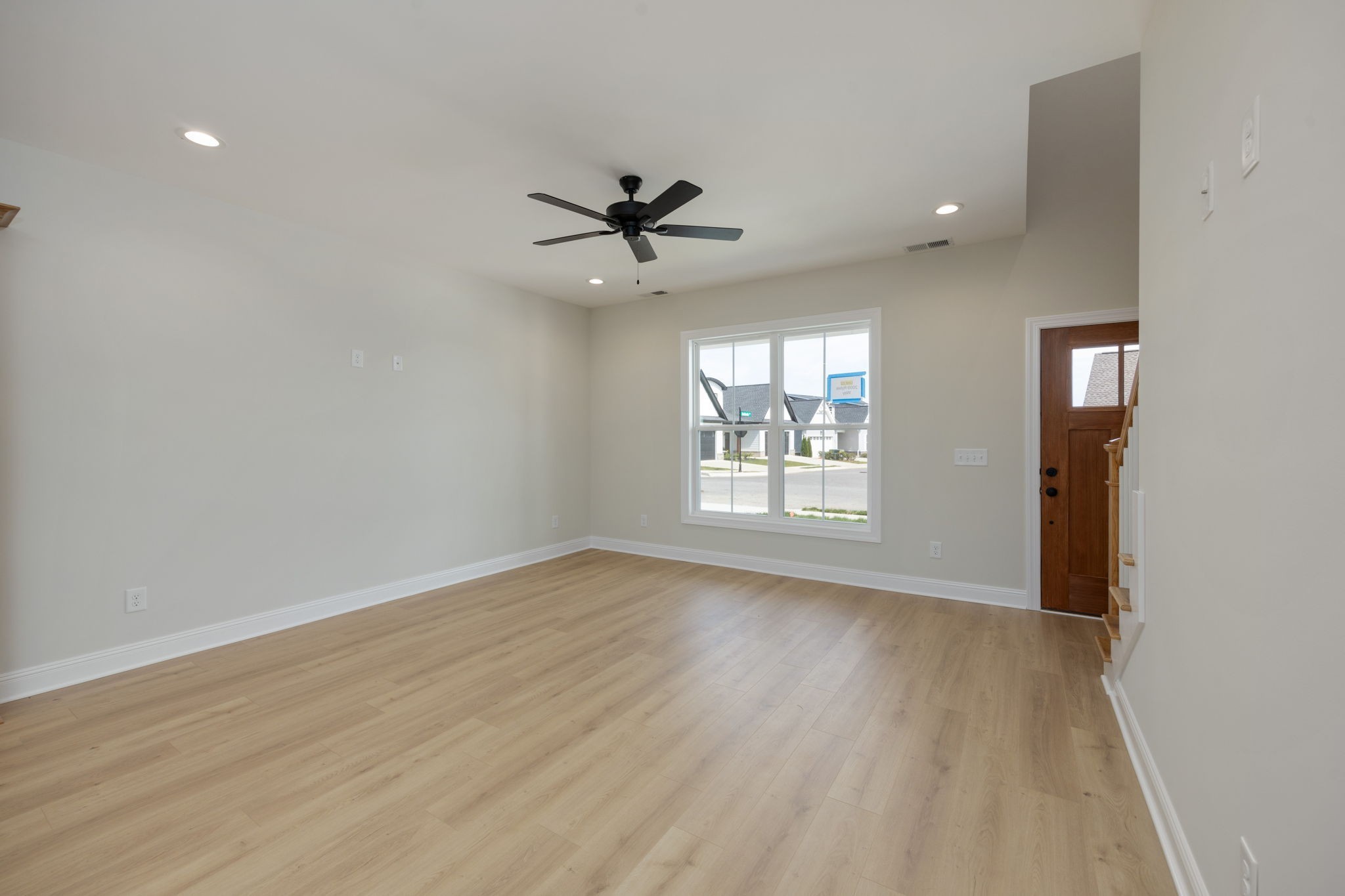 2009 Rylee Way, Unit 22 Greenbrier, TN 37073 - Photo 11 of 28 wooden floor in an empty room with a window