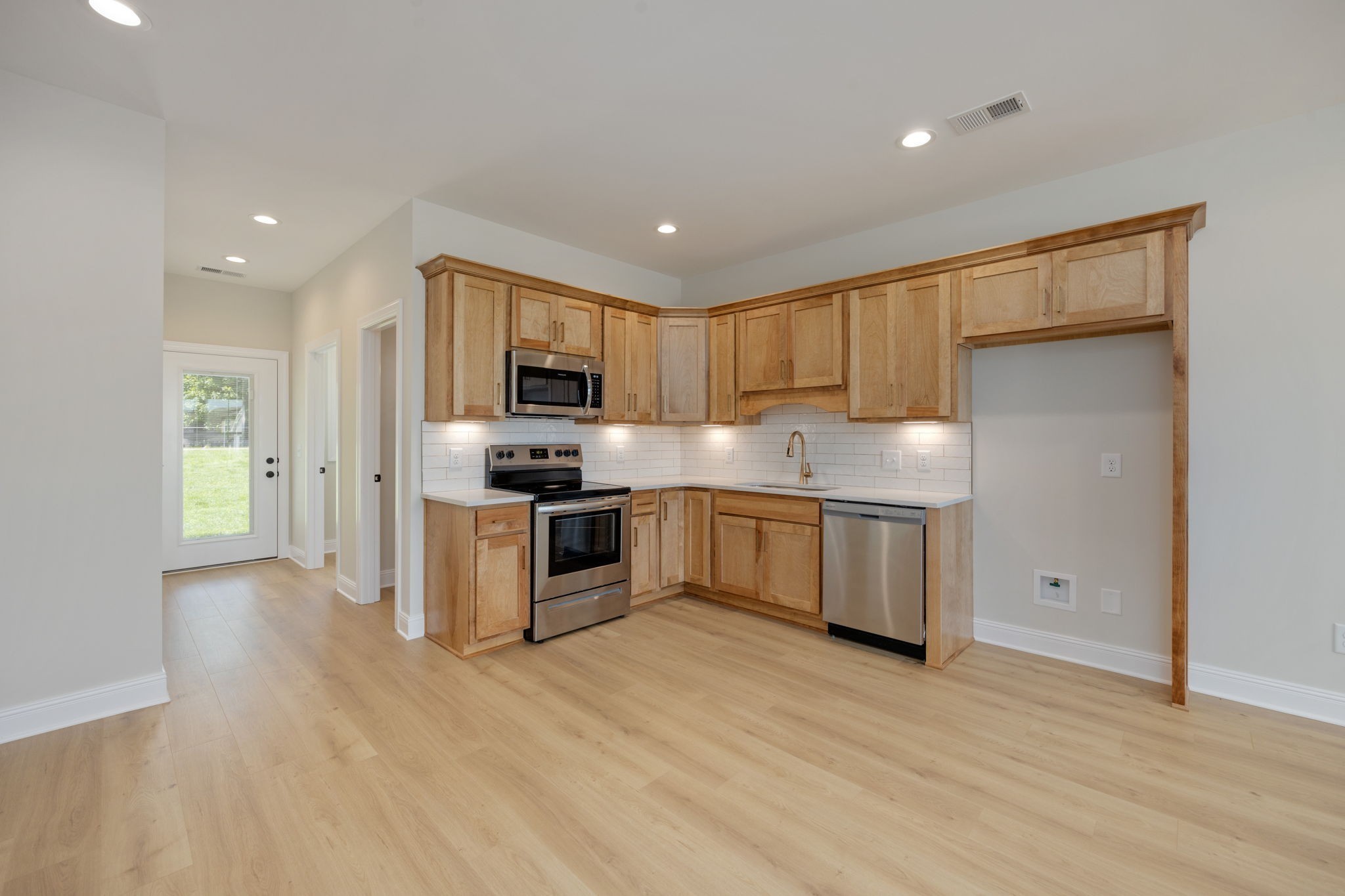 2009 Rylee Way, Unit 22 Greenbrier, TN 37073 - Photo 12 of 28 a kitchen with stainless steel appliances granite countertop a refrigerator sink and cabinets