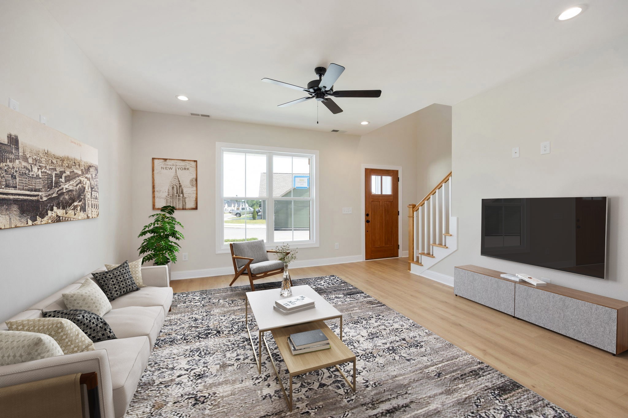 2009 Rylee Way, Unit 22 Greenbrier, TN 37073 - Photo 2 of 28 a living room with furniture and a flat screen tv