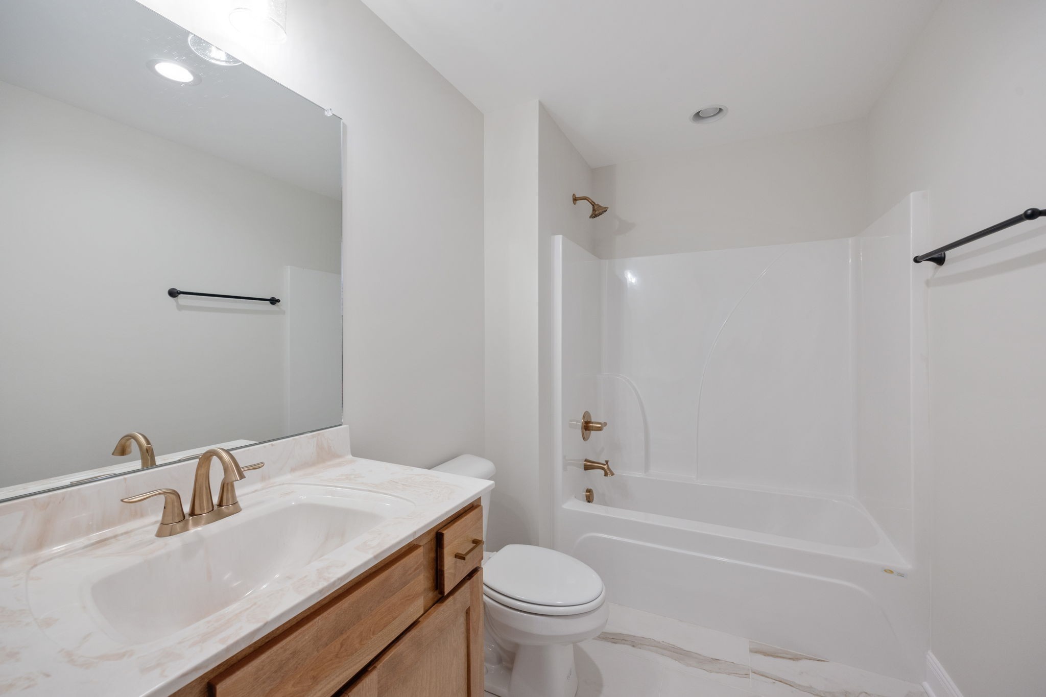 2009 Rylee Way, Unit 22 Greenbrier, TN 37073 - Photo 22 of 28 a bathroom with a sink toilet vanity and shower