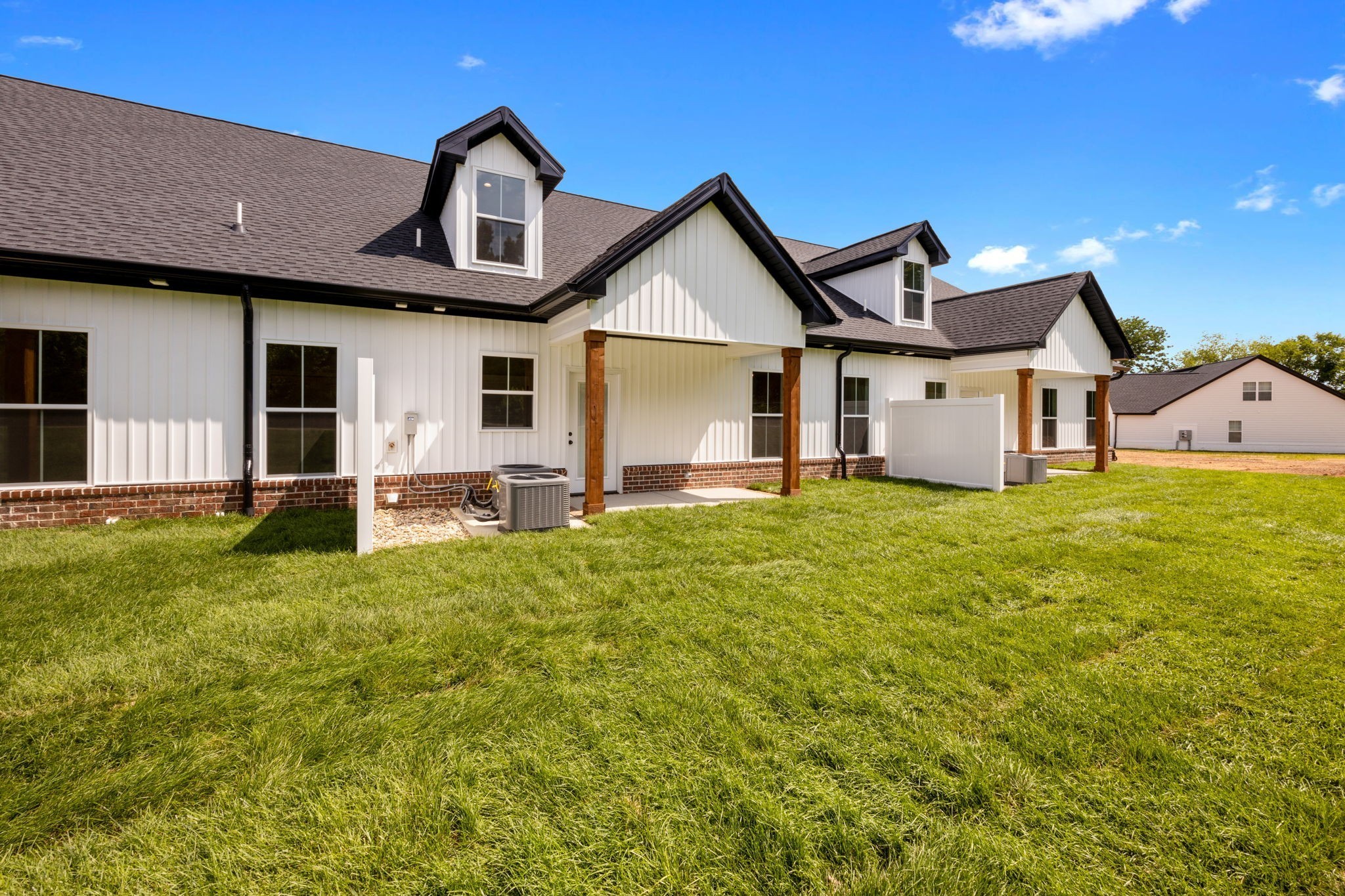 2009 Rylee Way, Unit 22 Greenbrier, TN 37073 - Photo 26 of 28 a front view of a house with garden
