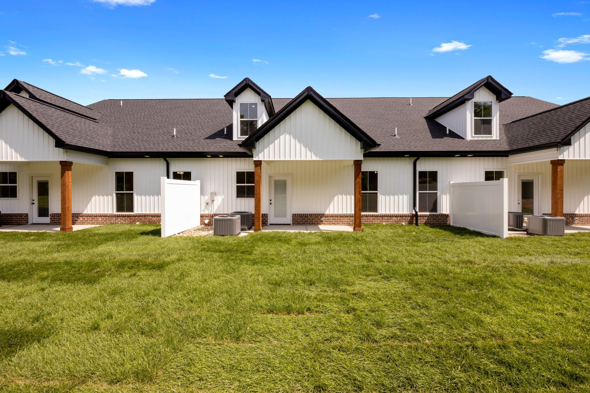 2009 Rylee Way, Unit 22 Greenbrier, TN 37073 - Photo 27 of 28 a front view of a house with a yard