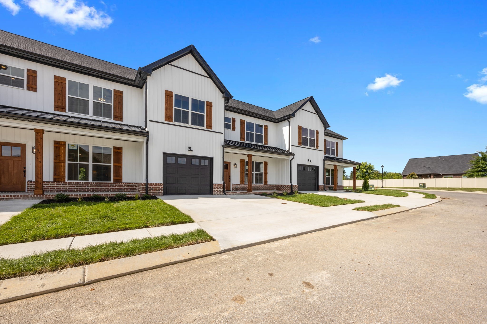 2009 Rylee Way, Unit 22 Greenbrier, TN 37073 - Photo 4 of 28 a front view of a house with a yard