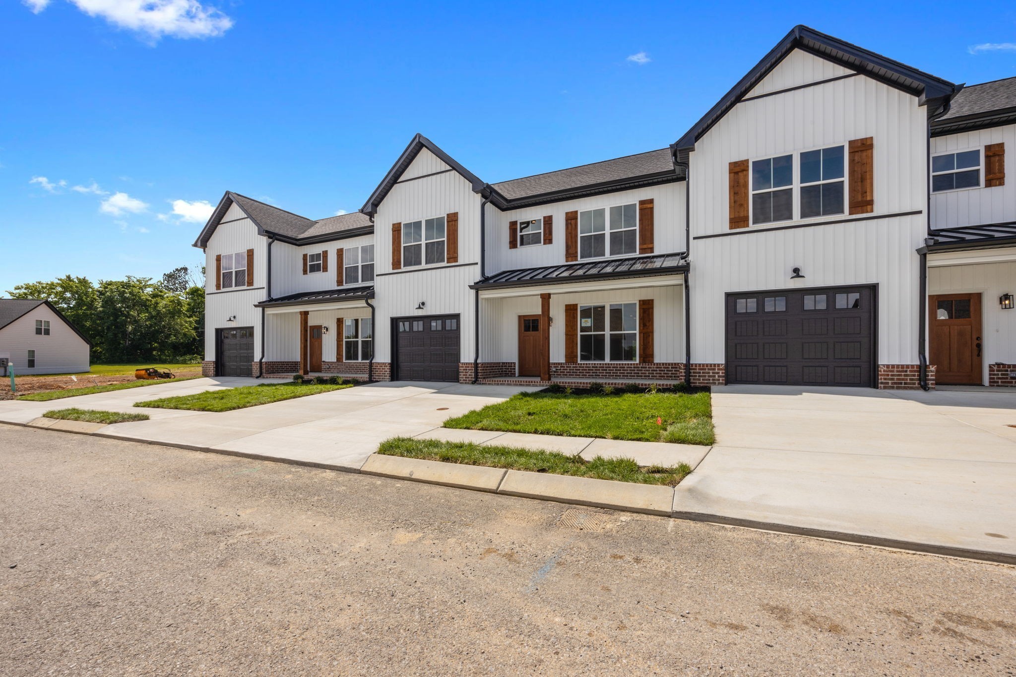 2009 Rylee Way, Unit 22 Greenbrier, TN 37073 - Photo 5 of 28 a front view of a house with a yard