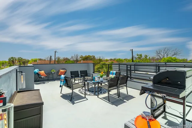 a view of chairs and table in patio