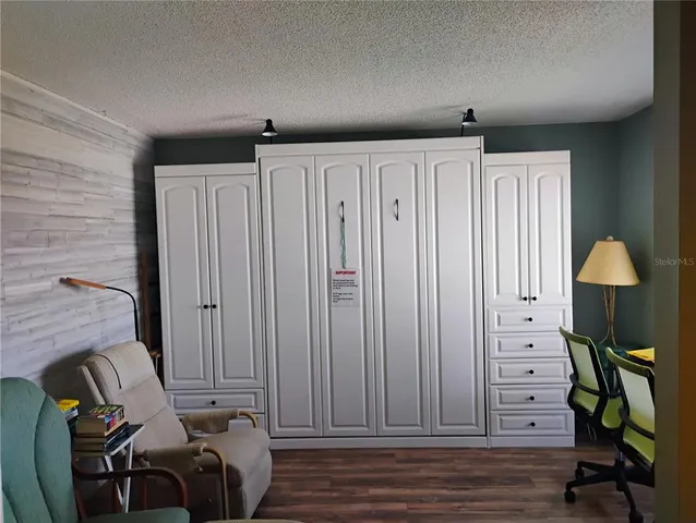 a view of a livingroom with furniture and wooden floor
