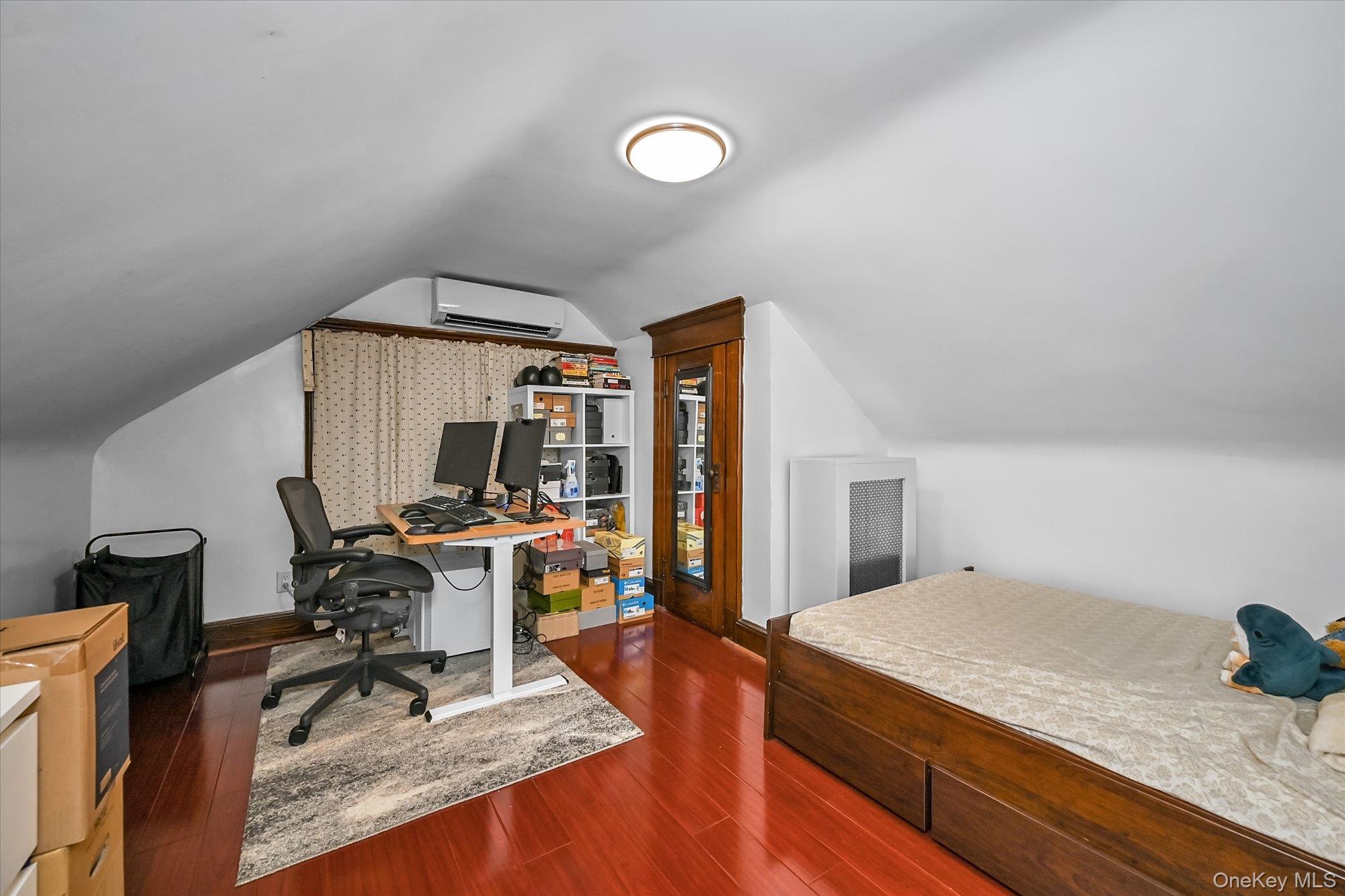87-71 111th Street Queens, NY 11418 - Photo 13 of 17 a view of a workspace with furniture and a window