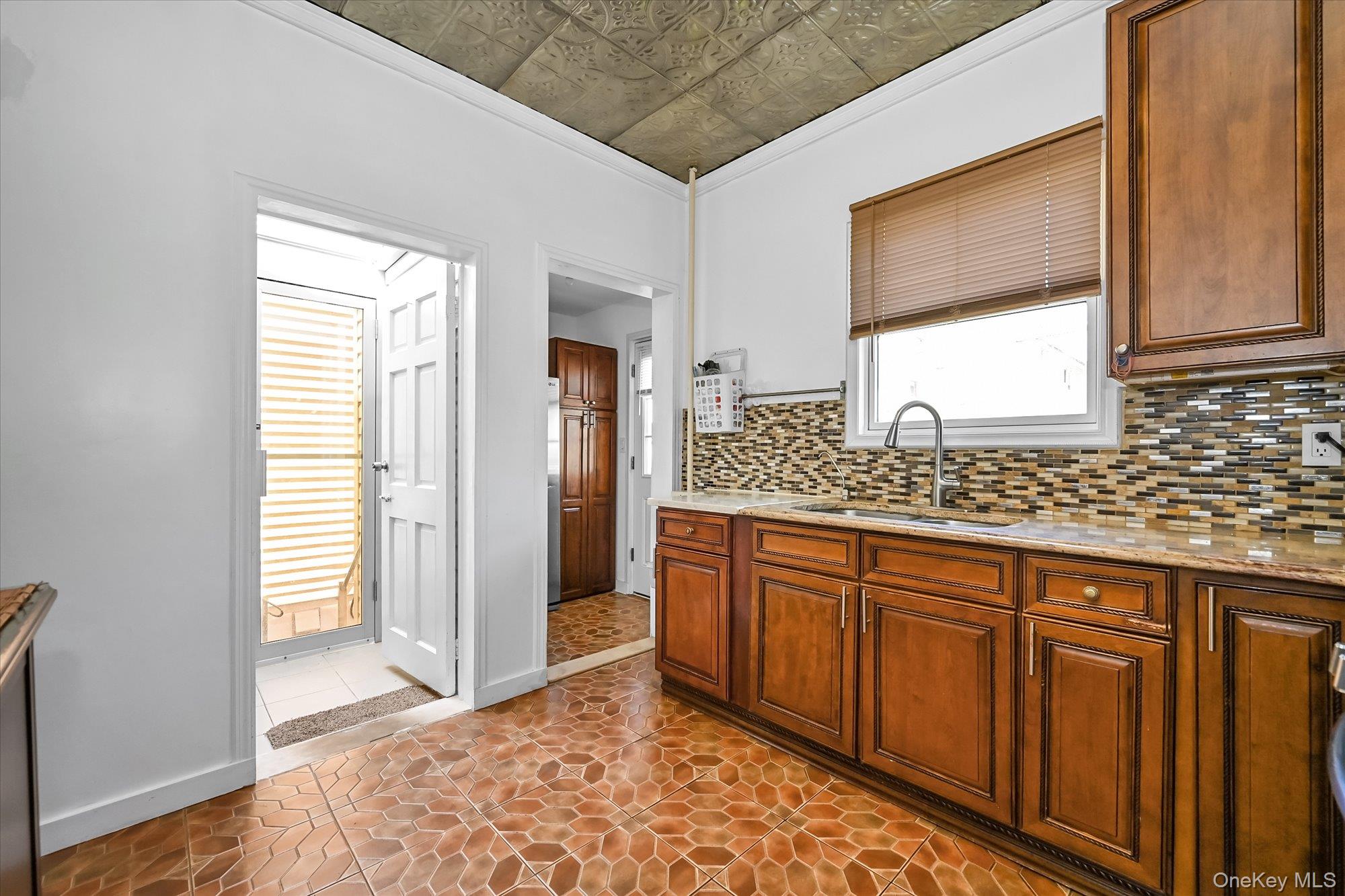 87-71 111th Street Queens, NY 11418 - Photo 7 of 17 a bathroom with a sink and a mirror