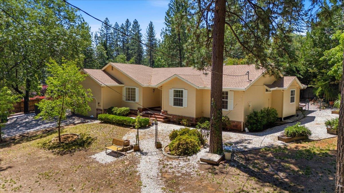 12600 Friar Tuck Road Grass Valley, CA 95949 - Photo 48 of 56 a front view of a house with garden