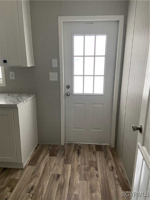 18 Smith Street Dendron, VA 23839 - Photo 4 of 10 a view of a room with wooden floor and a sink