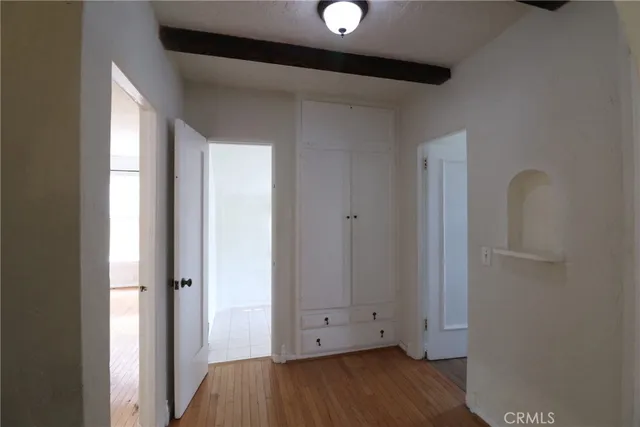 a view of room with wooden floor