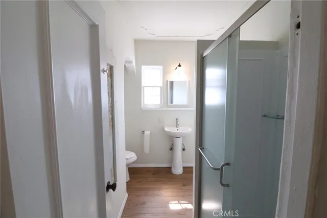 a bathroom view of a toilet and a sink