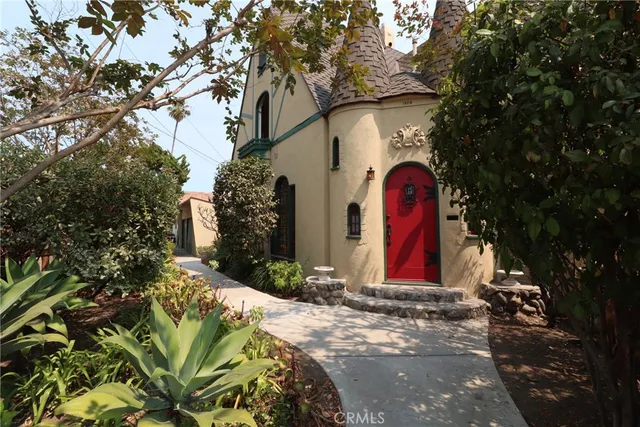 a view of a yard with yellow lighting