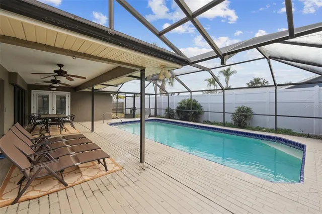 a view of swimming pool with seating area