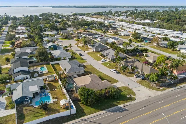 an aerial view of residential houses with outdoor space