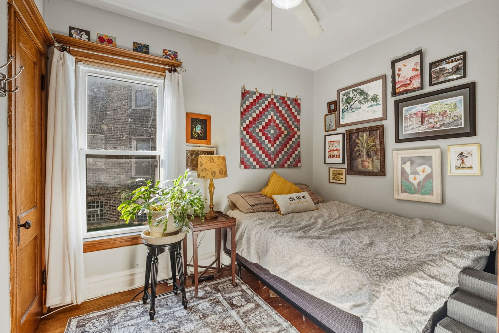 7127 South St Lawrence Avenue Chicago, IL 60619 - Photo 8 of 26 a bedroom with a bed and a painting on the wall