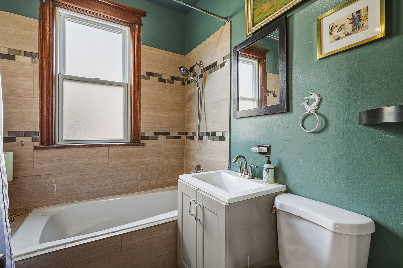 7127 South St Lawrence Avenue Chicago, IL 60619 - Photo 9 of 26 a bathroom with a sink a toilet and a bathtub