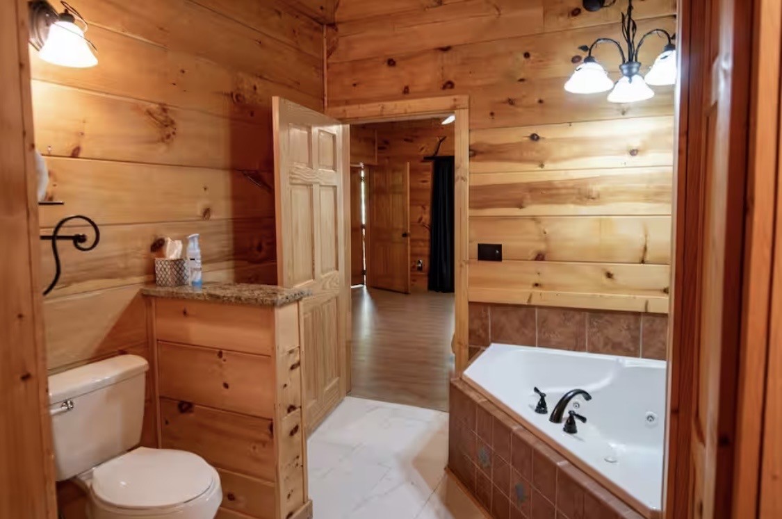298 Eagle Lake Road Coalmont, TN 37313 - Photo 11 of 38 a bathroom with a tub and a sink