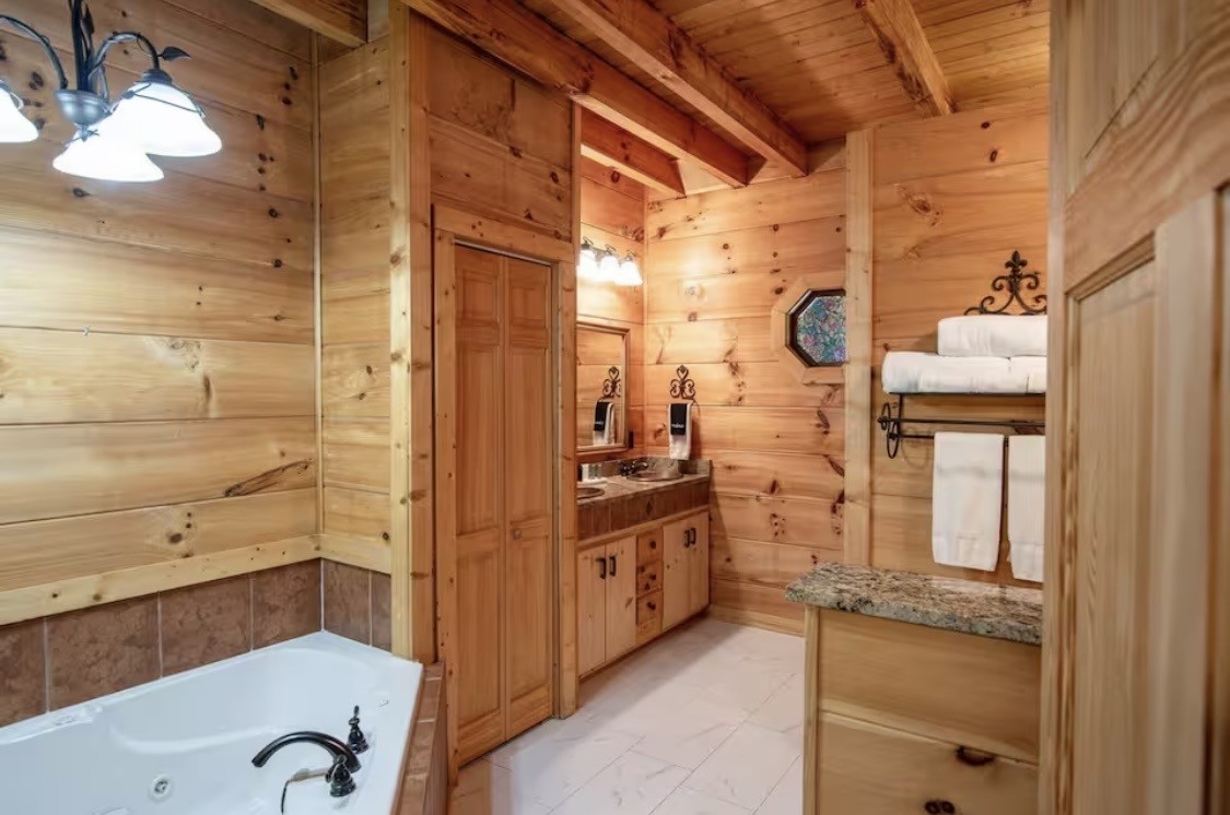 298 Eagle Lake Road Coalmont, TN 37313 - Photo 14 of 38 a bathroom with a tub and shower