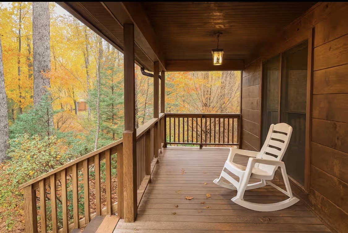298 Eagle Lake Road Coalmont, TN 37313 - Photo 2 of 38 a view of a chair in wooden deck