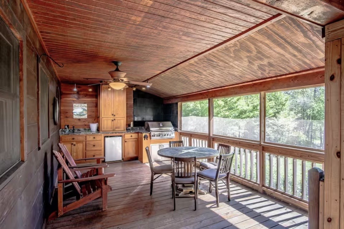298 Eagle Lake Road Coalmont, TN 37313 - Photo 22 of 38 a view of a dining room with furniture window and wooden floor