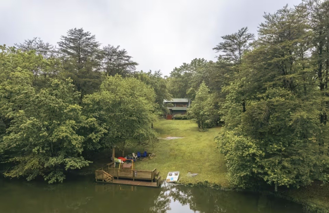 298 Eagle Lake Road Coalmont, TN 37313 - Photo 28 of 38 a lake view with boat and trees in the background