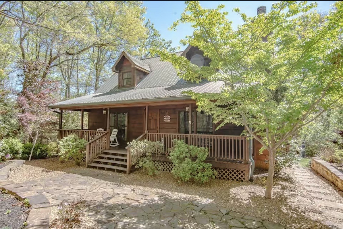 298 Eagle Lake Road Coalmont, TN 37313 - Photo 3 of 38 a front view of a house with garden