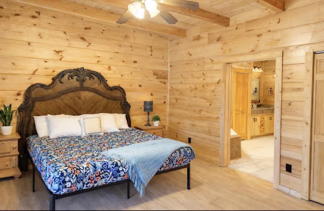298 Eagle Lake Road Coalmont, TN 37313 - Photo 10 of 38 a bedroom with a bed and wooden floor