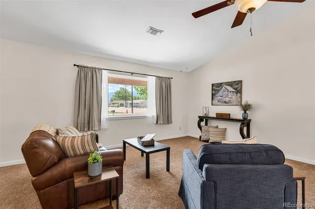 a living room with furniture and a window