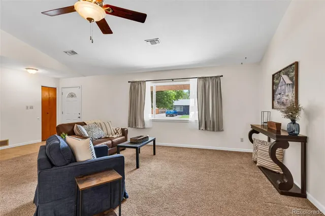 a living room with furniture and a window