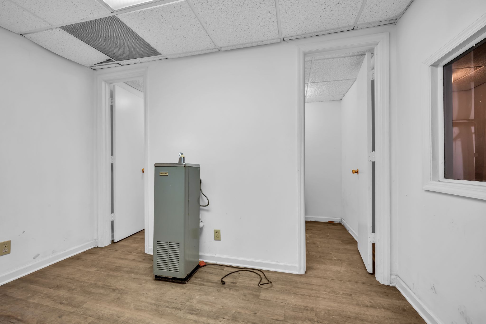 2340 Ridge Road McEwen, TN 37101 - Photo 65 of 72 an empty room with wooden floor and a hallway