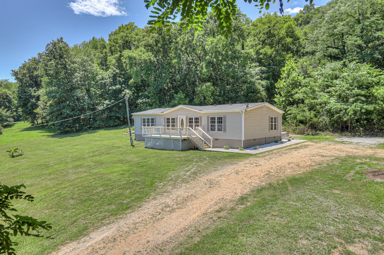 4002 Rippey Lake Road Mount Pleasant, TN 38474 - Photo 2 of 43 a view of a house with backyard and garden