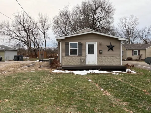 a view of a backyard of the house