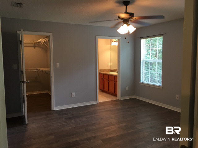 226 Montclair Loop Daphne, AL 36526 - Photo 10 of 27 226 Montclair Loop | Lake Forest | Tile Floor | LVT Flooring | Black Appliances | Back Deck