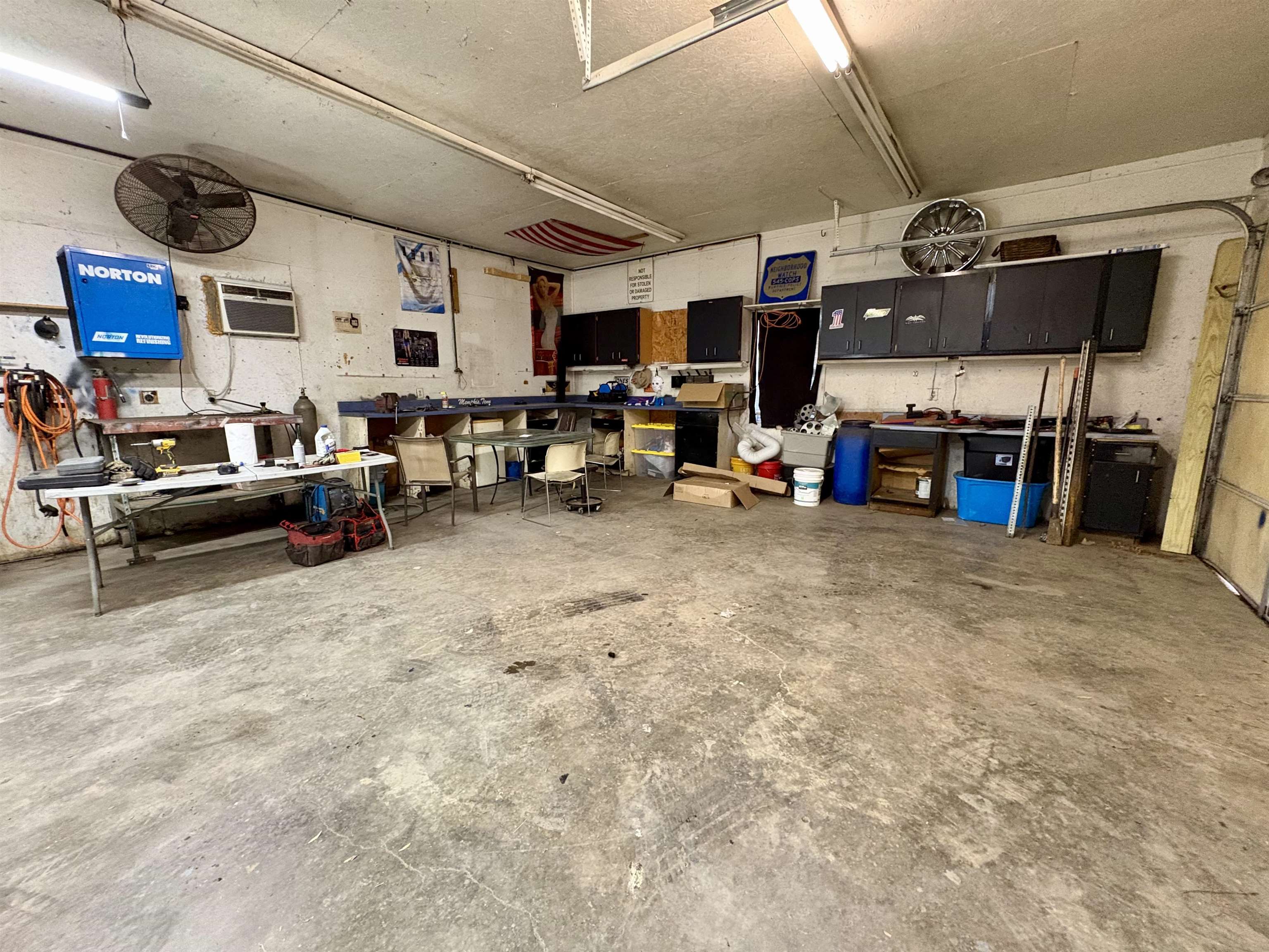 3507 Chowning Road Memphis, TN 38135 - Photo 16 of 17 Garage featuring a workshop area and an AC wall unit
