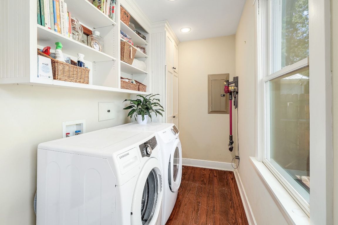 1006 East 44th Street Austin, TX 78751 - Photo 13 of 28 a view of washer and dryer with kitchen in the background