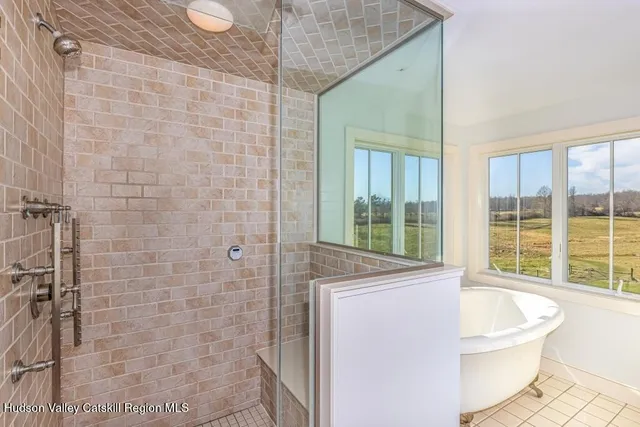 a bathroom with a bathtub and window
