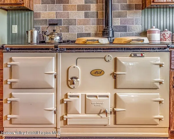 a kitchen with a stove and a refrigerator