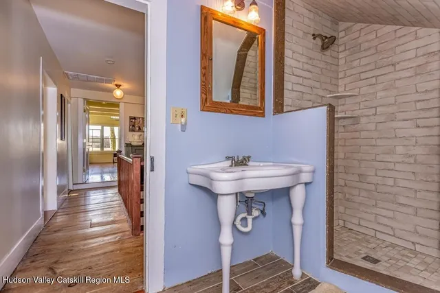 a bathroom with a sink and a mirror