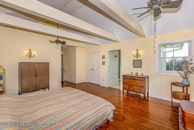 a bedroom with a bed and a table