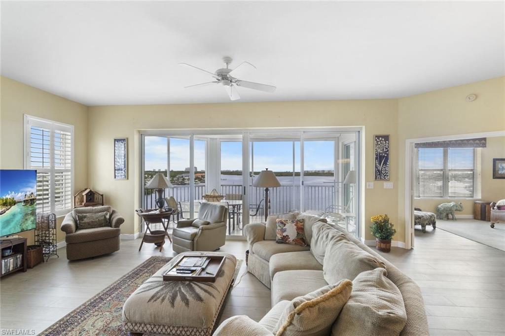 4975 Bonita Beach Road Southwest, Unit 6 Bonita Springs, FL 34134 - Photo 2 of 3 a living room with furniture and a large window