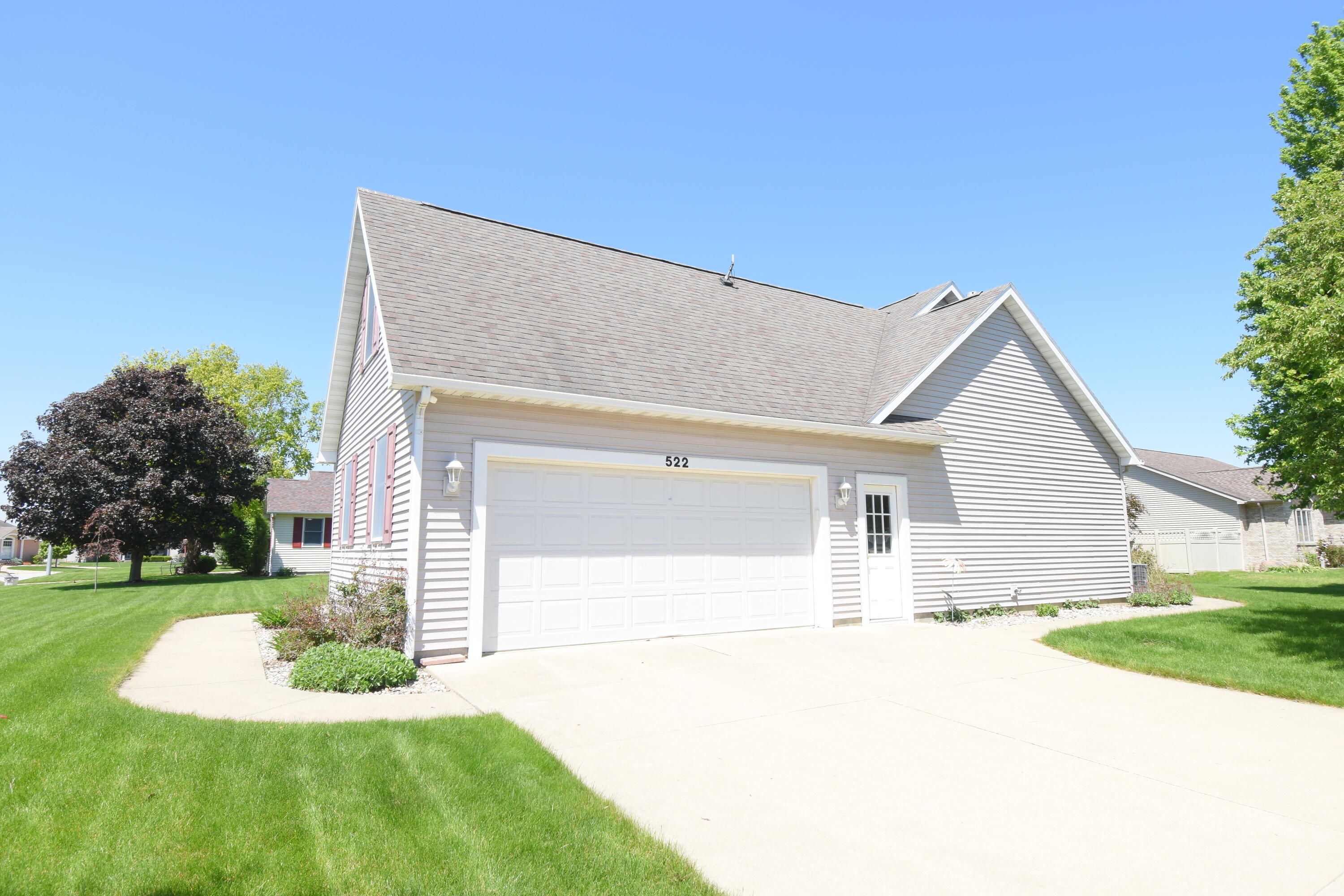 522 Pheasant Run Rensselaer, IN 47978 - Photo 9 of 55 a view of a house with a yard and garage
