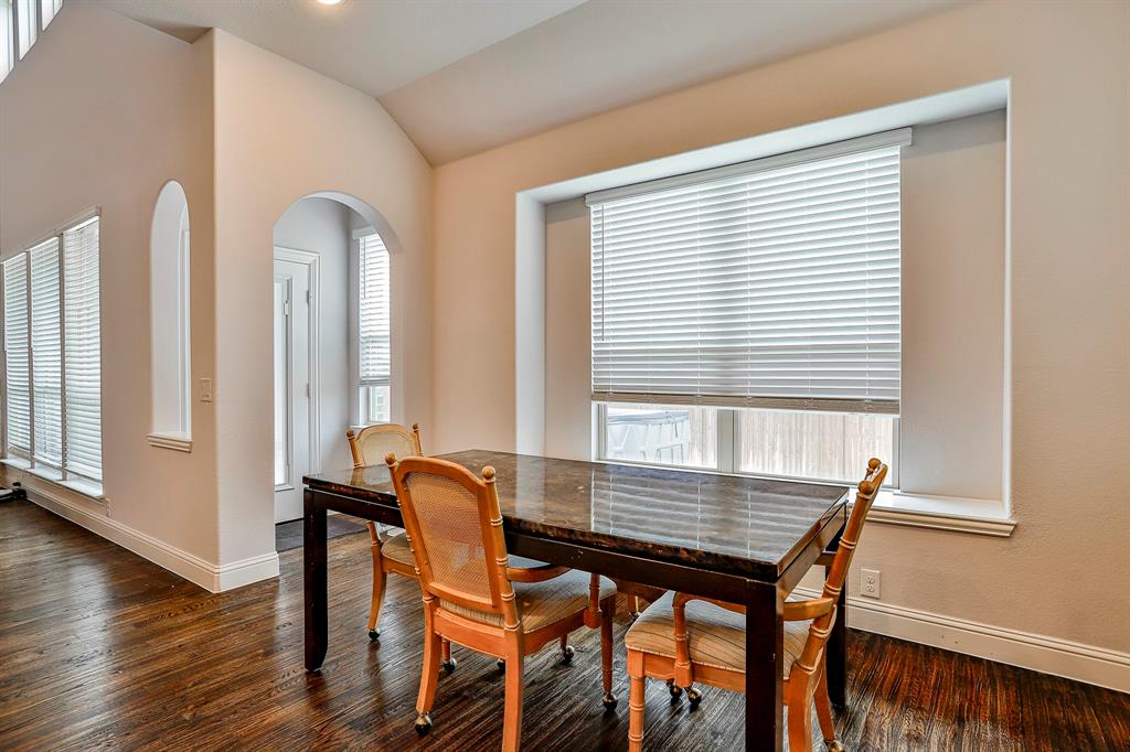 2425 Turning Leaf Lane Midlothian, TX 76065 - Photo 23 of 29 Dining area with dark wood finished floors and vaulted ceiling