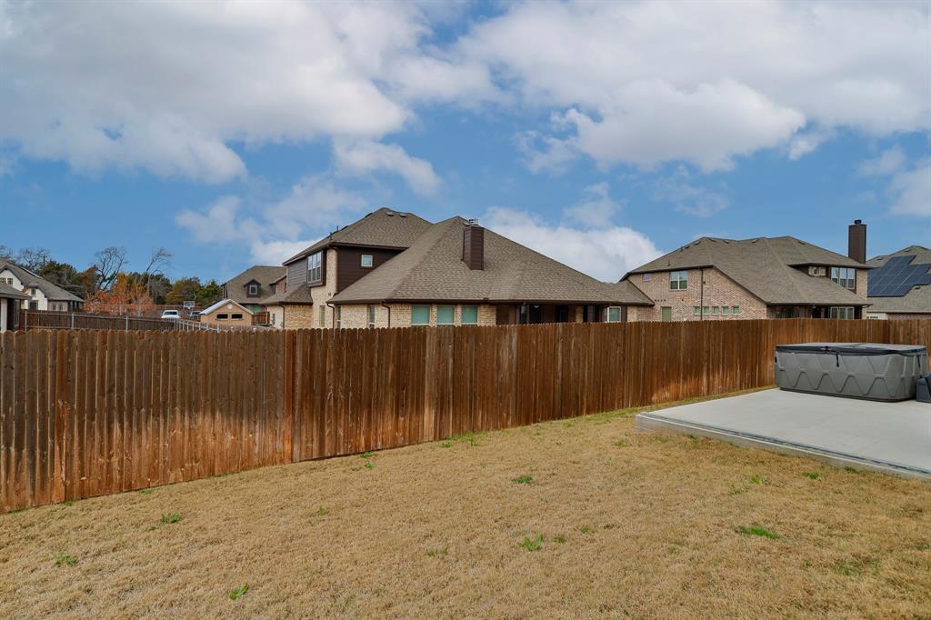 2425 Turning Leaf Lane Midlothian, TX 76065 - Photo 27 of 29 Fenced backyard with a residential view